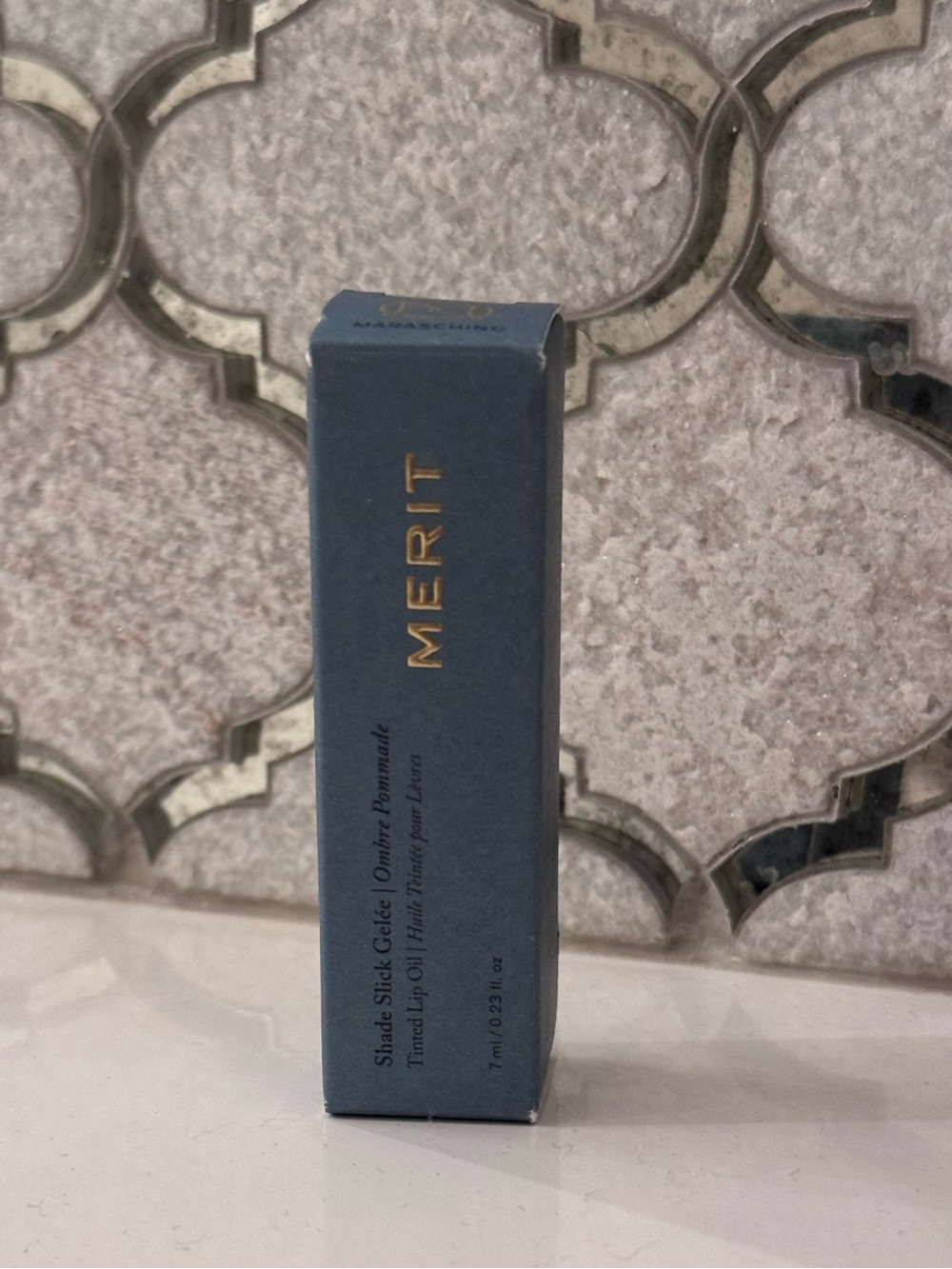Merit Tinted Lip Oil Balm in Shade Maraschino